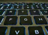 Backlit laptop keyboard, illustrating differential privacy in machine learning