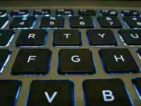 Backlit laptop keyboard, illustrating differential privacy in machine learning
