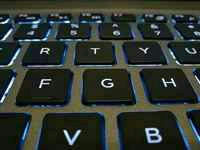 Backlit laptop keyboard, illustrating what is cloud computing and edge AI